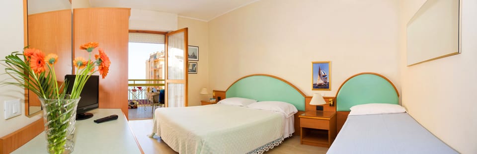 Family Room | Premium bedding, down comforters, desk, laptop workspace