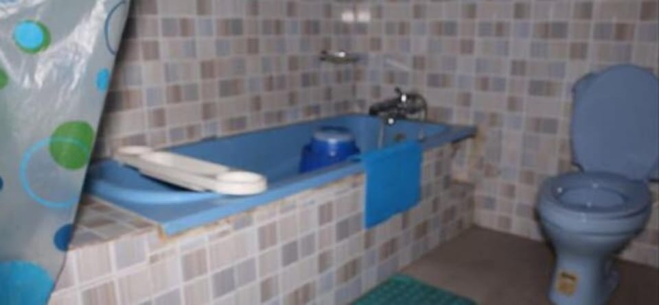 Separate tub and shower, bathrobes, slippers, towels