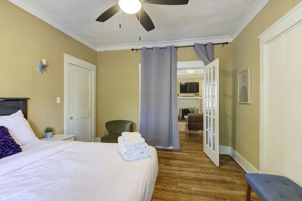 Comfort meets charm — unwind after a long day in this inviting queen bedroom.