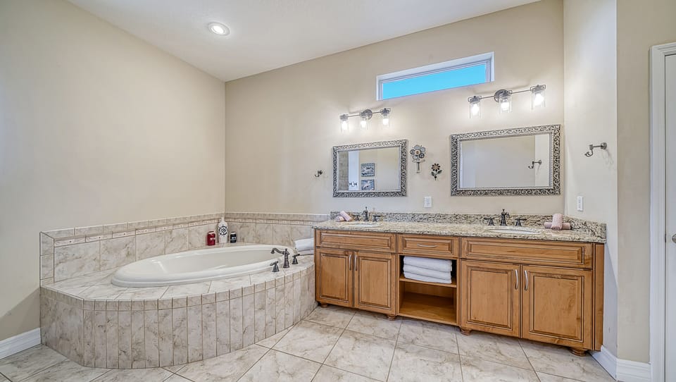 The ensuite with clean lines, spa tones, and soothing waters—start and end each day refreshed.