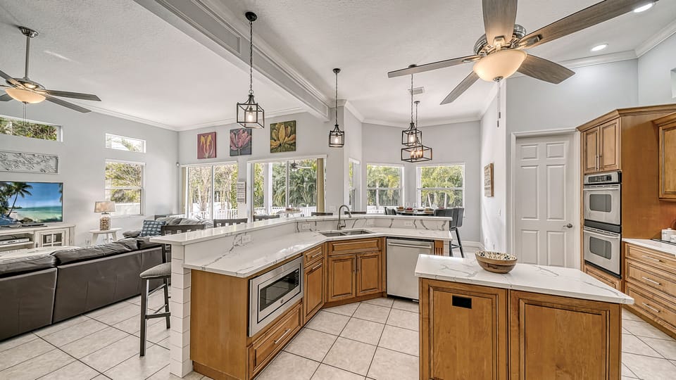 This open-concept kitchen and living room blend seamlessly, creating the perfect space to cook, relax and connect.