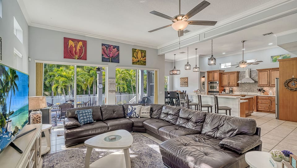 Slide open the doors and let the island air in—this sun-kissed space blends indoor comfort with seamless outdoor living.