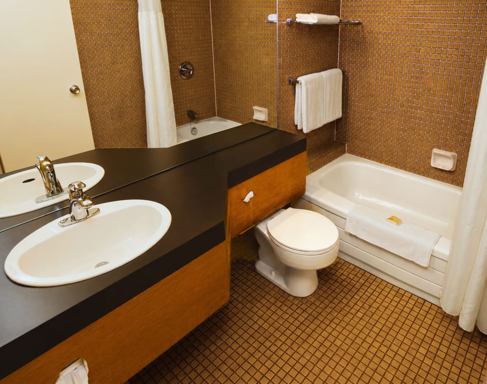 Classic Room, 2 Queen Beds | Bathroom | Combined shower/tub, free toiletries, hair dryer, towels