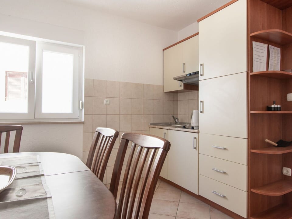 Apartment | Private kitchen | Fridge, highchair