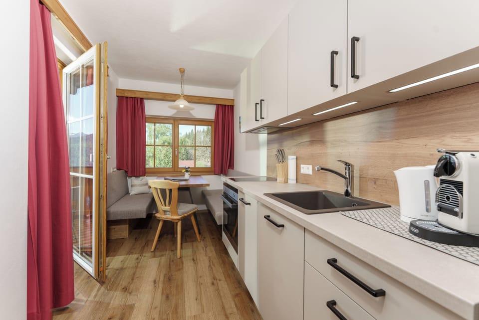 Comfort Condo, Balcony | Private kitchen | Full-size fridge, microwave, stovetop, dishwasher