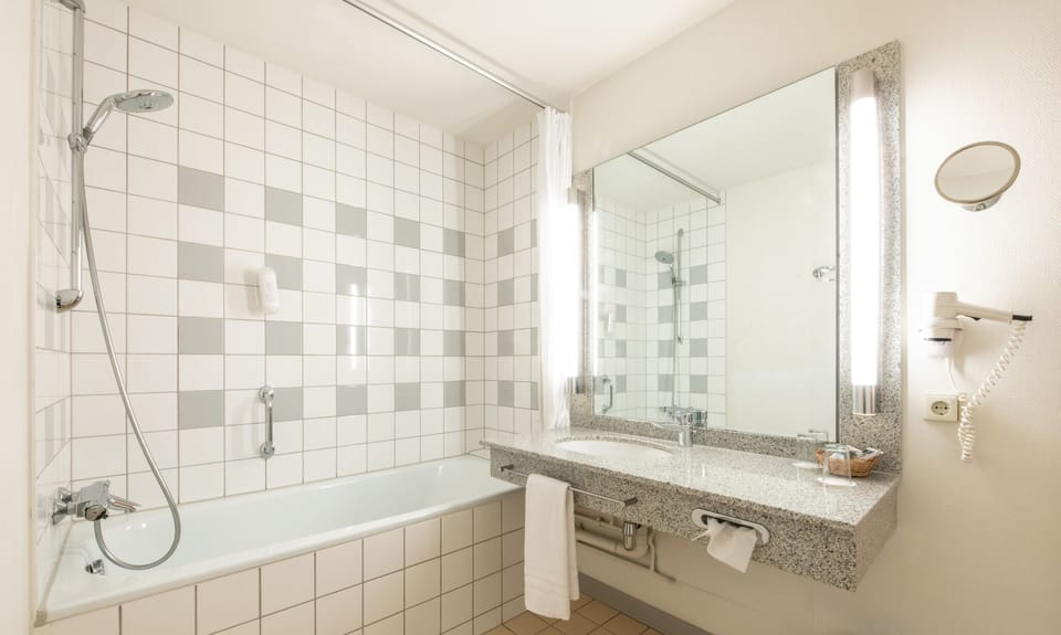 Shower, eco-friendly toiletries, hair dryer, towels