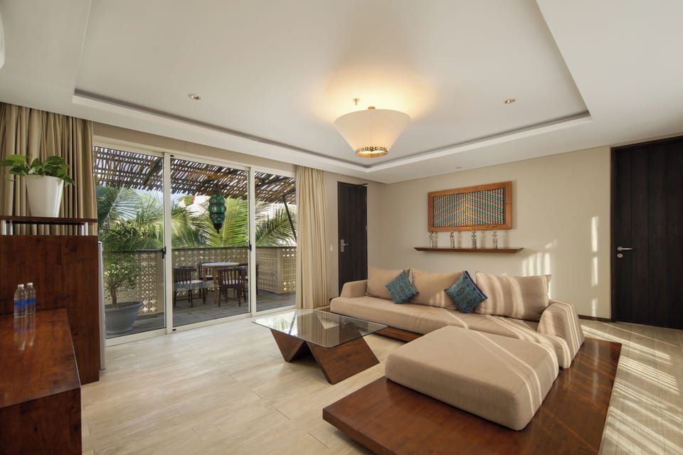Two Bedroom Suite | Living area | 32-inch LED TV with cable channels, TV