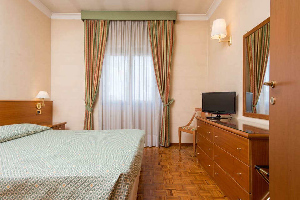 Family Quadruple Room | Premium bedding, minibar, in-room safe, desk