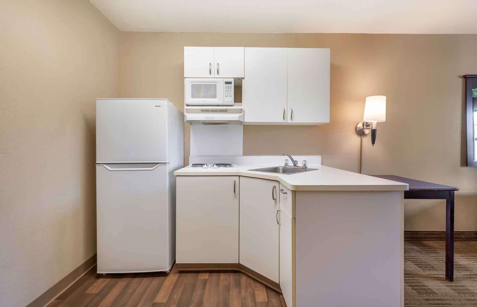 Studio, 1 Queen Bed, Non Smoking | Private kitchen | Full-size fridge, microwave, stovetop