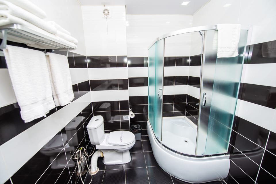Family Room, 2 Bedrooms | Bathroom | Shower, free toiletries, hair dryer, slippers