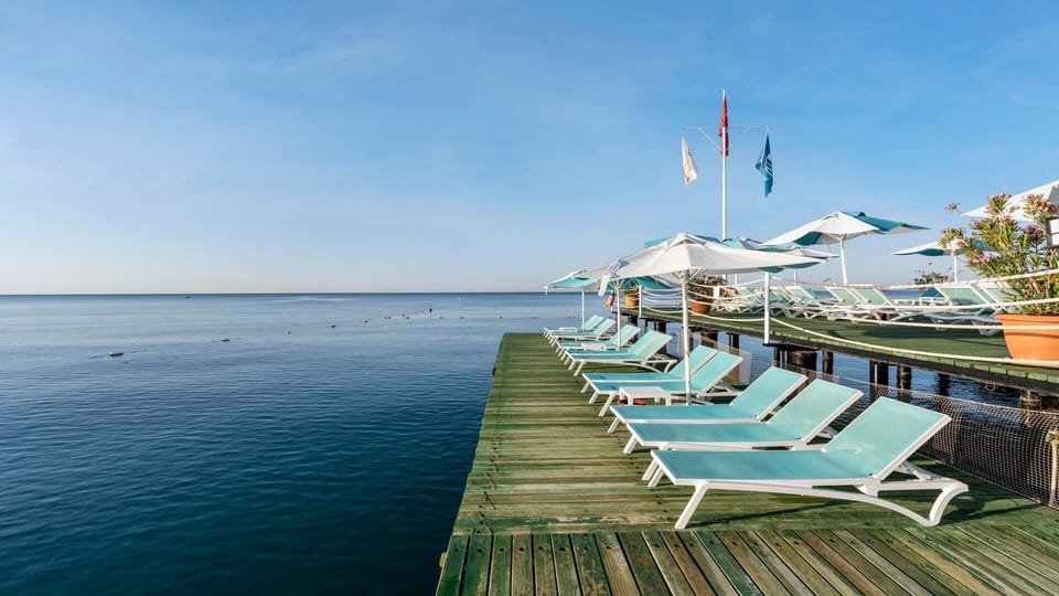Private beach, free beach shuttle, beach cabanas, sun loungers