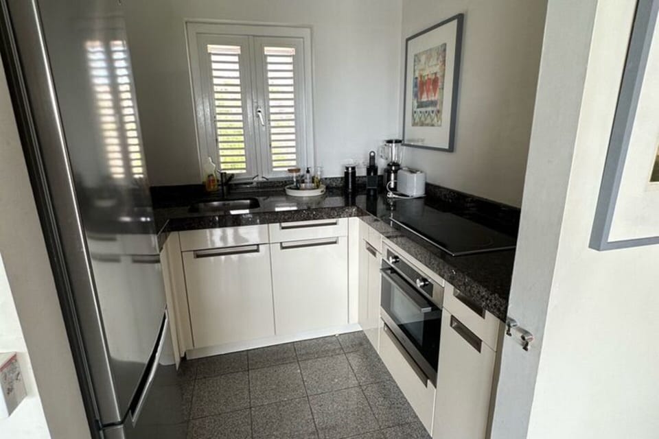 Villa | Private kitchen | Microwave, highchair