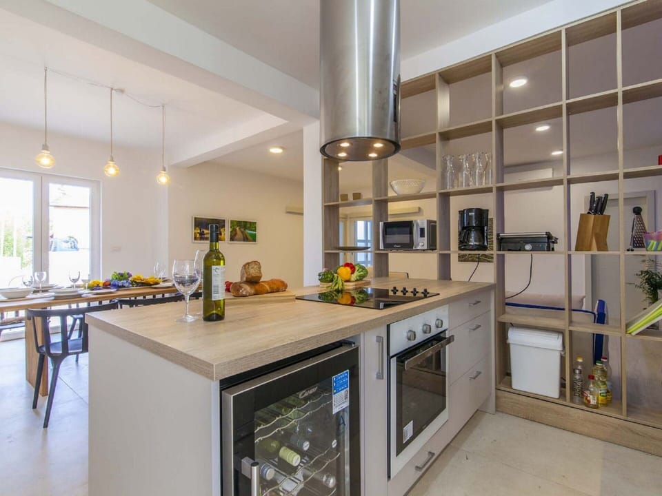 Villa | Private kitchen | Electric kettle, highchair