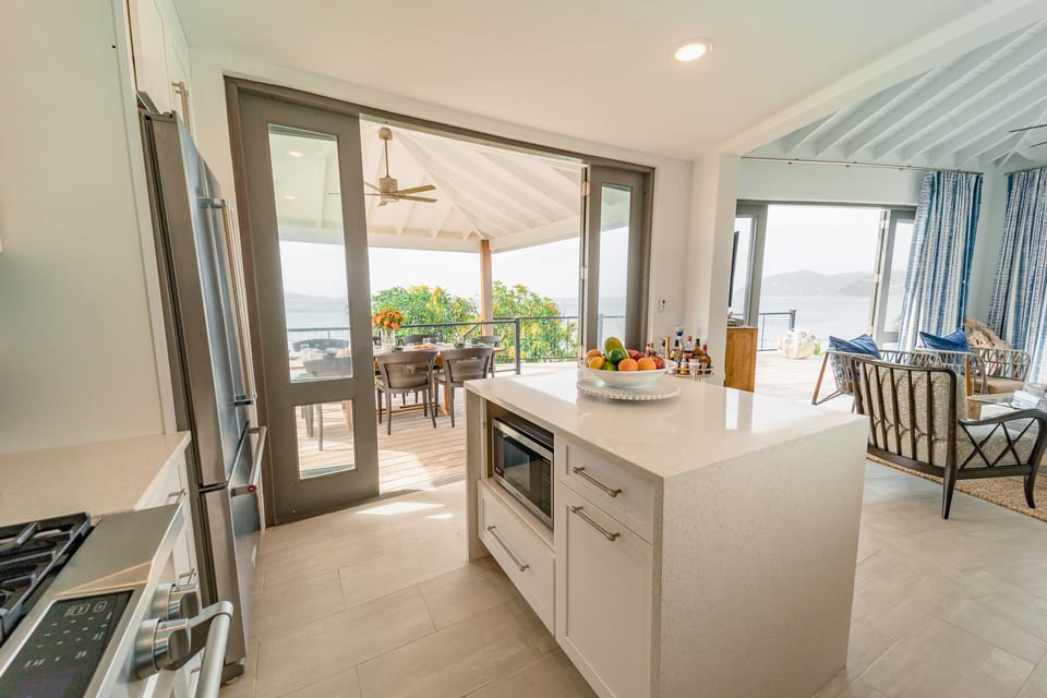Top of the range modern kitchen with island unit. Opens out to outdoor dining 