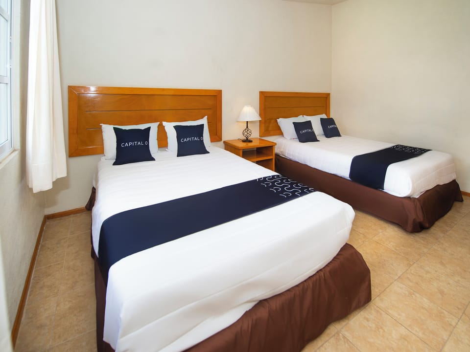 Premium bedding, desk, laptop workspace, iron/ironing board