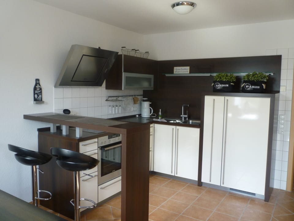 Apartment | Private kitchen | Stovetop, highchair