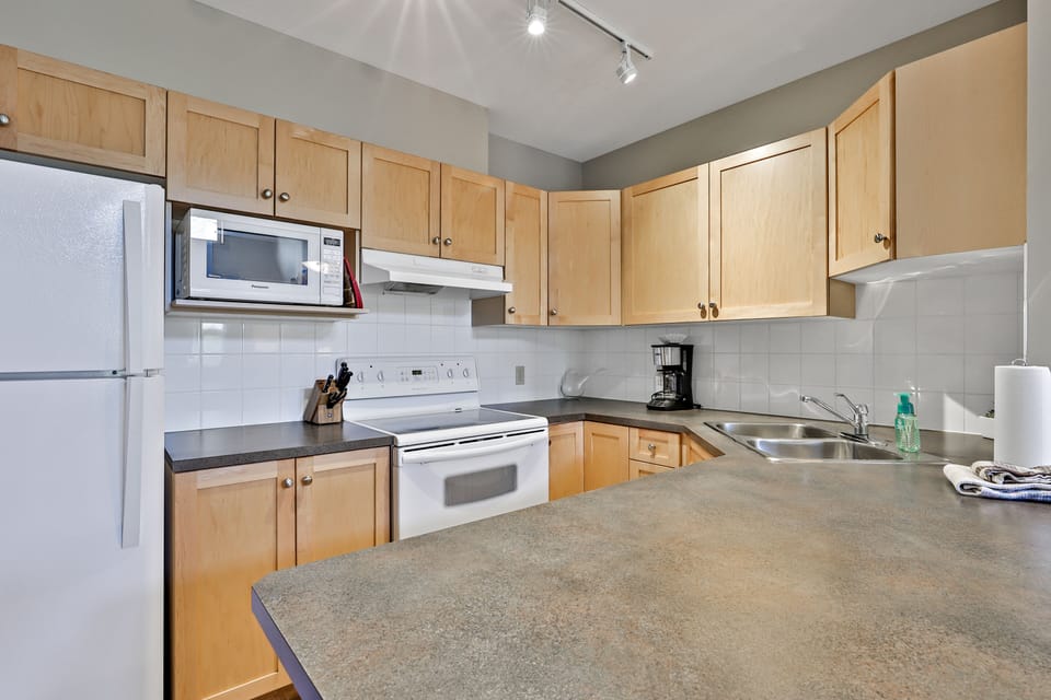 Well equipped kitchen with toaster, coffee maker, blender, crock-pot etc.