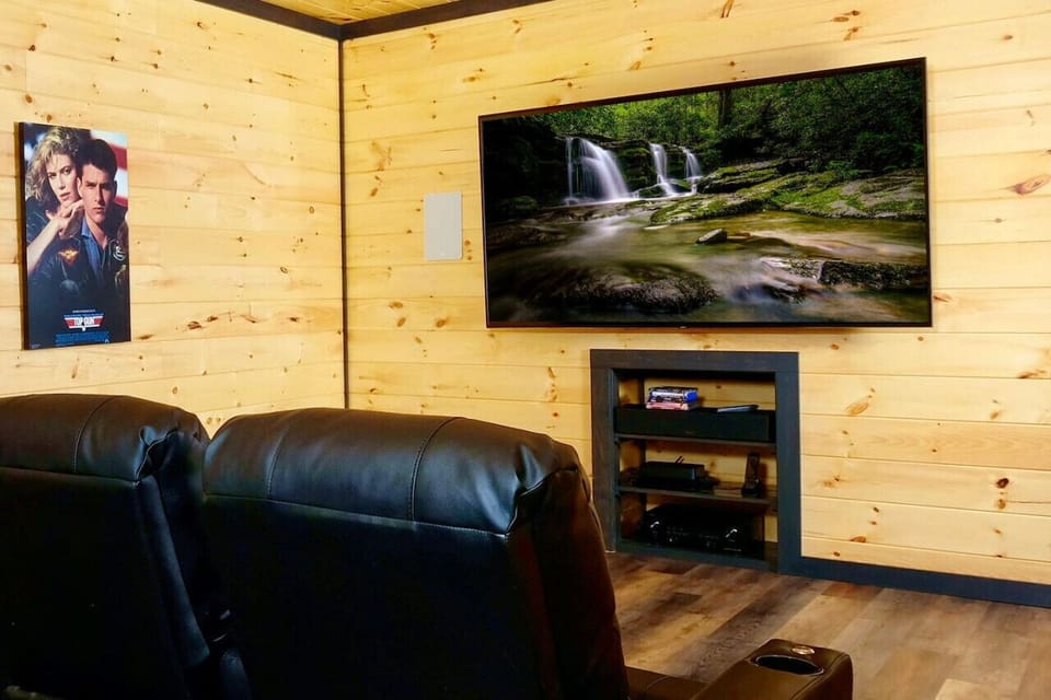 The theater room has a massive 82 inch 4K HDTV with premium cable and a Blu-Ray.