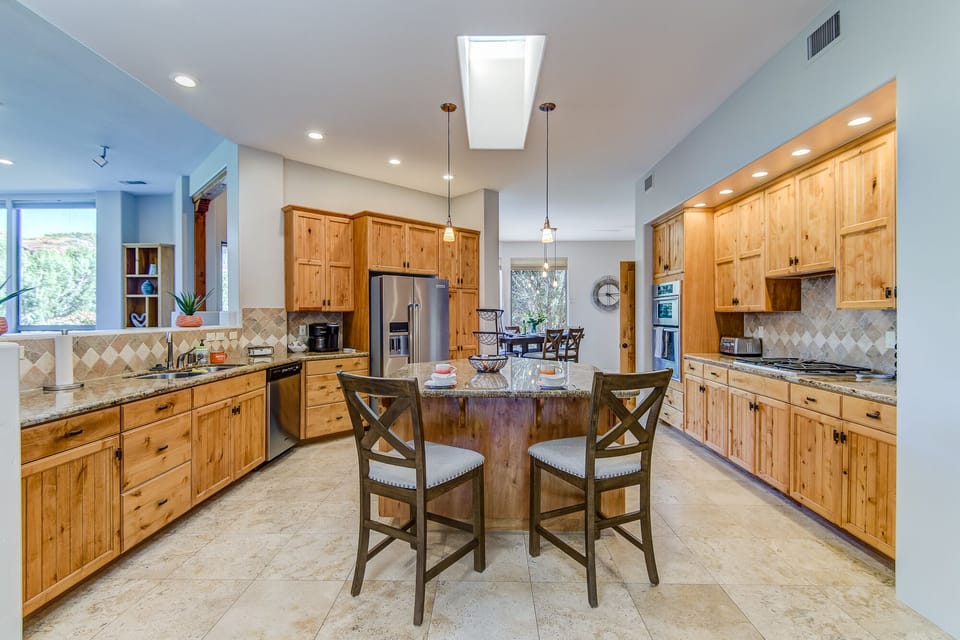 Center Island Seating and Plenty of Granite Counter Space for Meal Prep and Entertaining