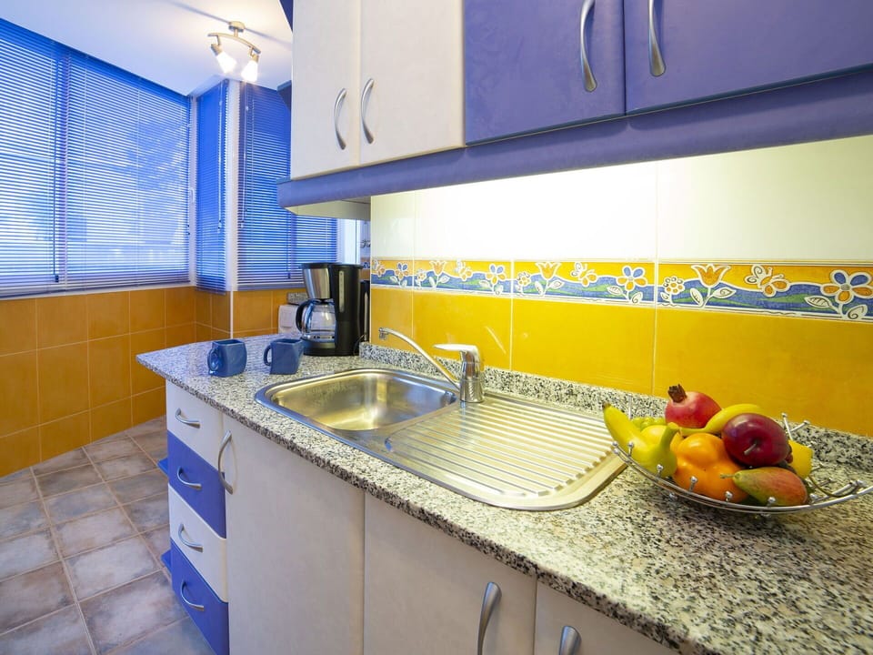 Countertop, Property, Room, Yellow, Kitchen, Interior Design, Furniture, House, Cabinetry, Real Estate