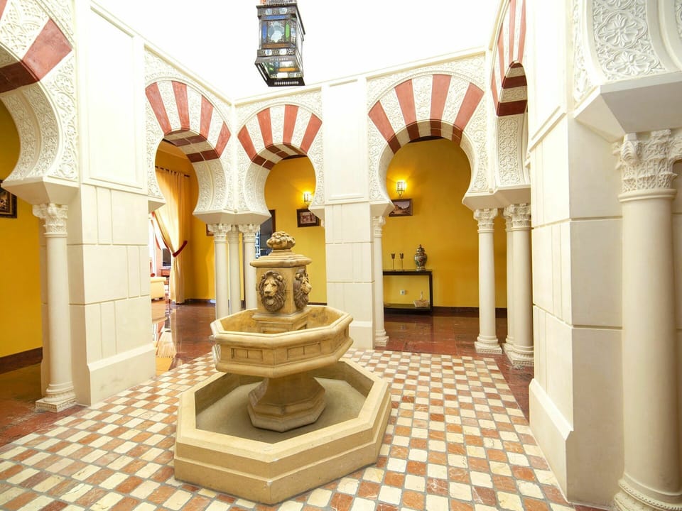 Yellow, Interior Design, Building, Art, House, Arcade, Ceiling, Arch, Flooring, Room