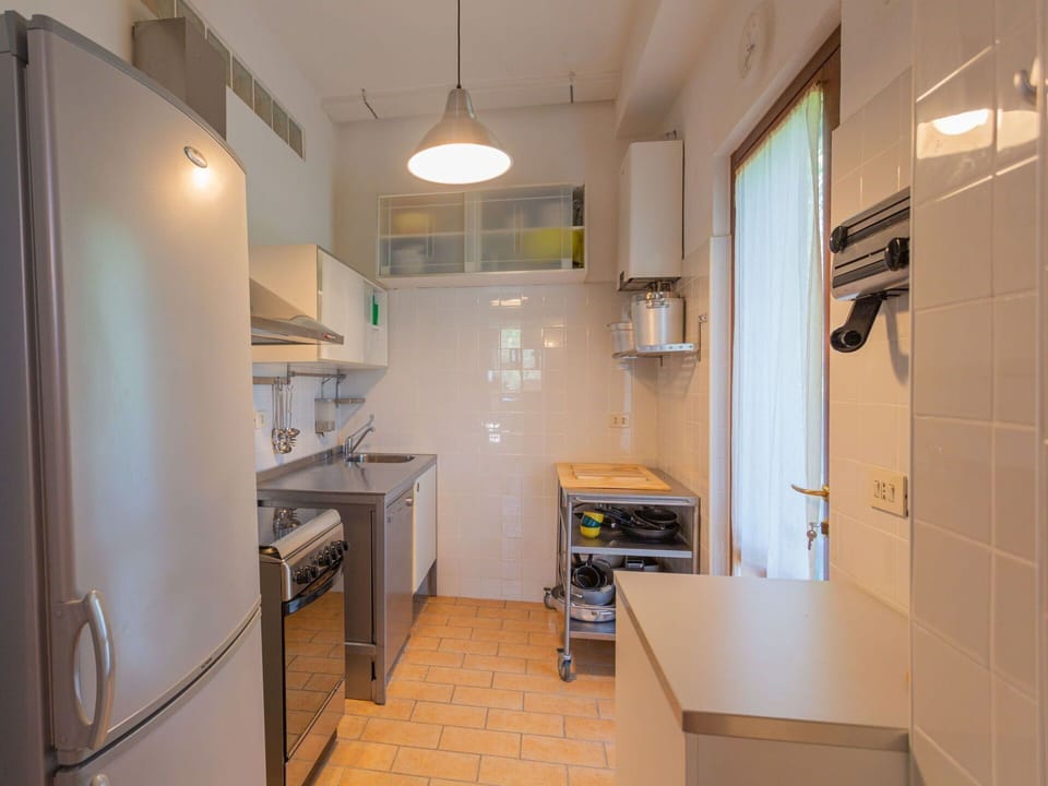 Cabinetry, Countertop, Property, Furniture, Building, Sink, Kitchen, Kitchen Appliance, Lighting, Kitchen Stove
