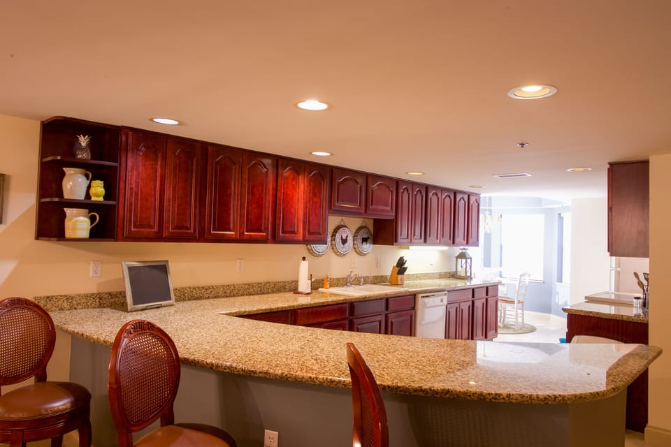 Large kitchen with cherry cabinets and granite countertops