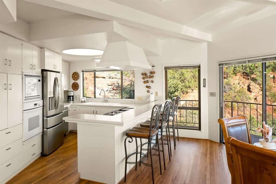 The kitchen is fully-equipped with modern appliances and amenities