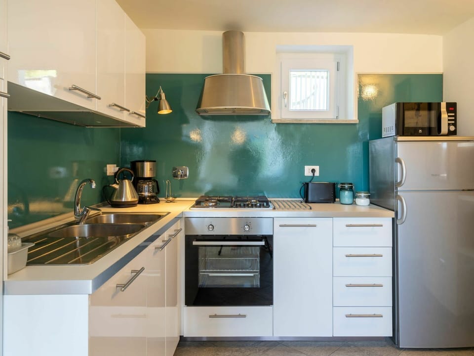Countertop, Cabinetry, Kitchen, Room, Furniture, Property, Turquoise, Green, Interior Design, Kitchen Stove