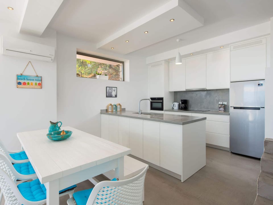 Villa | Private kitchen | Fridge, microwave, stovetop, dishwasher
