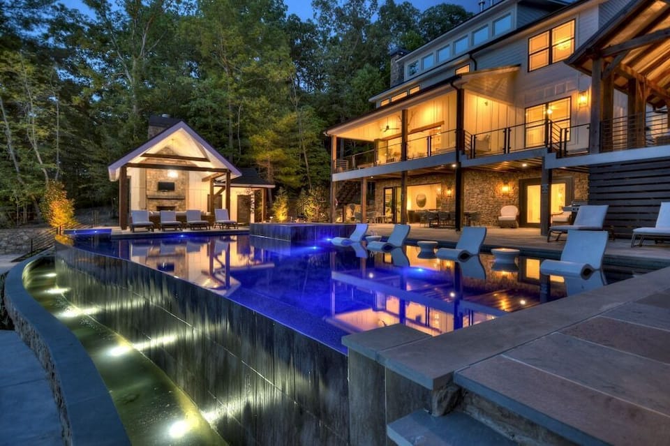 Immerse yourself in luxury at our outdoor pool and living area, beautifully illuminated with gorgeous lighting that sets the perfect mood for any occasion. Enjoy your favorite tunes with our Sonos speakers, elevating your experience as you relax and unwind