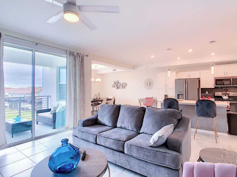 Bright Open-Concept Living Room with Balcony Access
