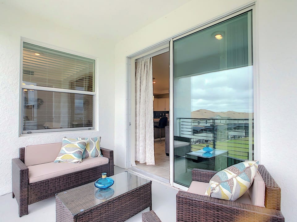 Private Covered Balcony with Comfortable Wicker Seating