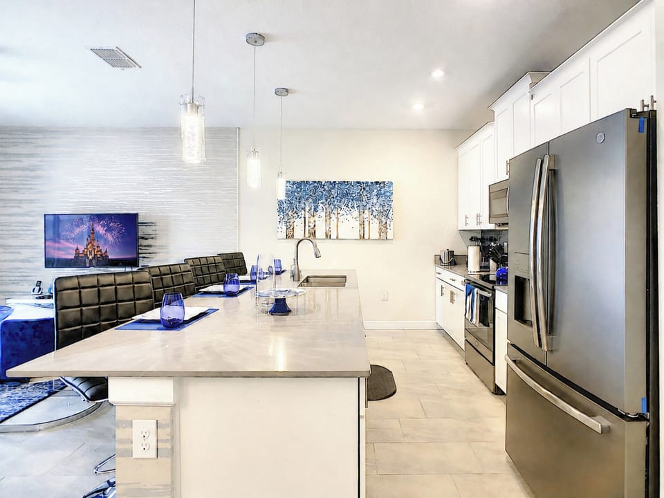 Modern kitchen with stainless steel appliances and island seating