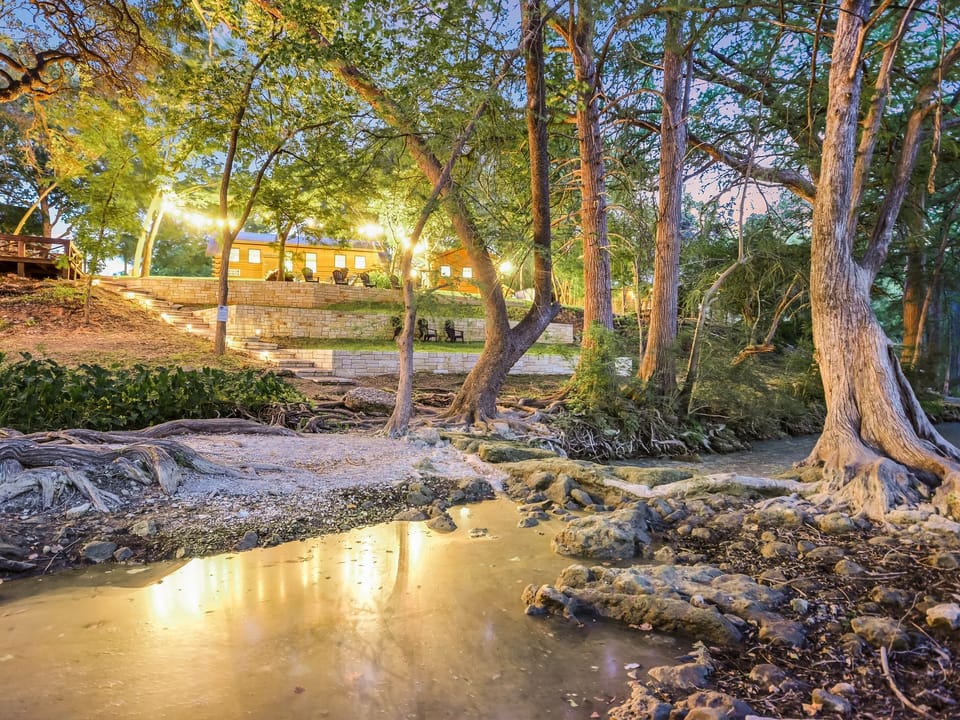 Spring-fed Cypress Creek flowing through the property just steps from Wimberley Square
