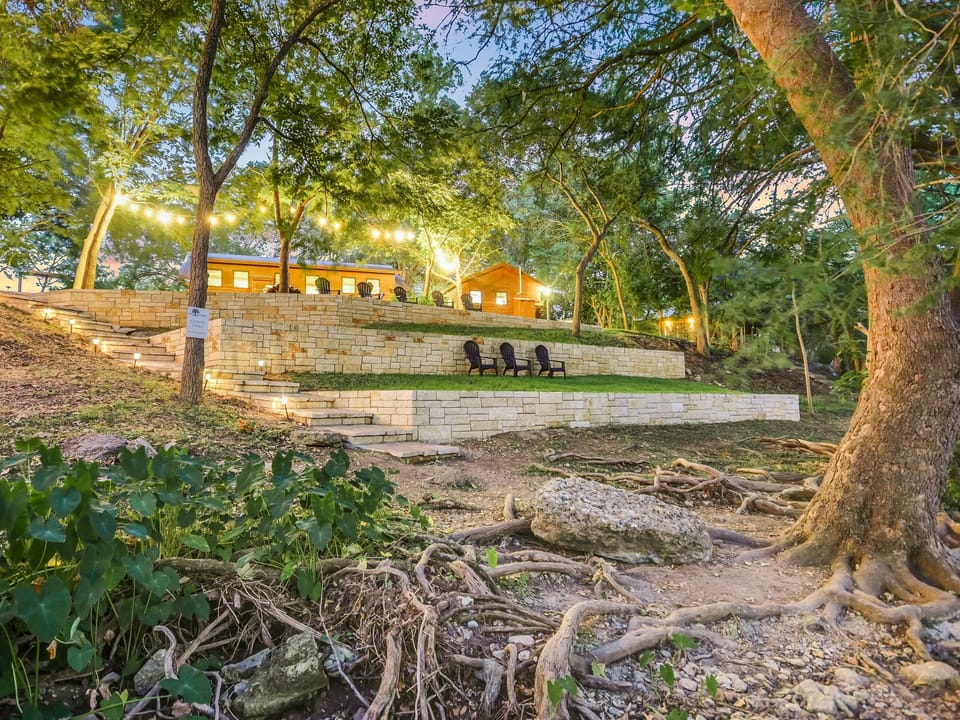 Terraced creekside seating with limestone walls near downtown Wimberley