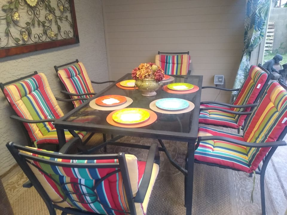 enjoy this dining area for six or the two side patio tables seating of eight