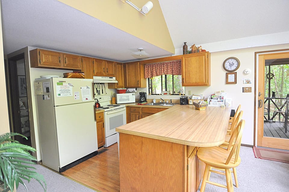 Cabin, Multiple Beds (Fox Hollow - Cozy Den with a Hot Tub ) | Private kitchen | Fridge, freezer, spices, paper towels