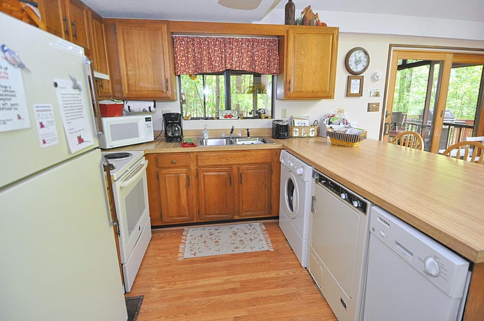 Cabin, Multiple Beds (Fox Hollow - Cozy Den with a Hot Tub ) | Private kitchen | Fridge, freezer, spices, paper towels