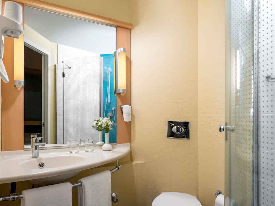 Shower, eco-friendly toiletries, hair dryer, slippers