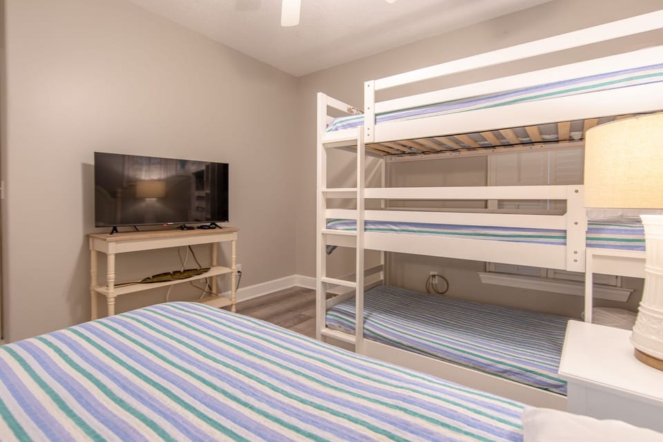4th bedroom with twin and triple bunk bed.
