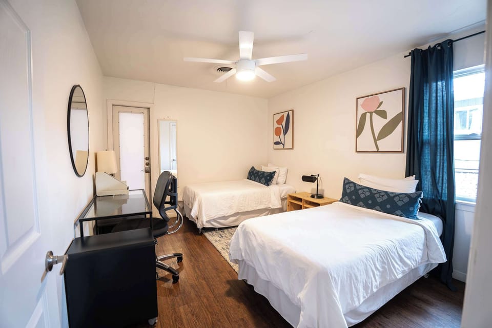 Bedroom 2: Two twin beds with a workstation