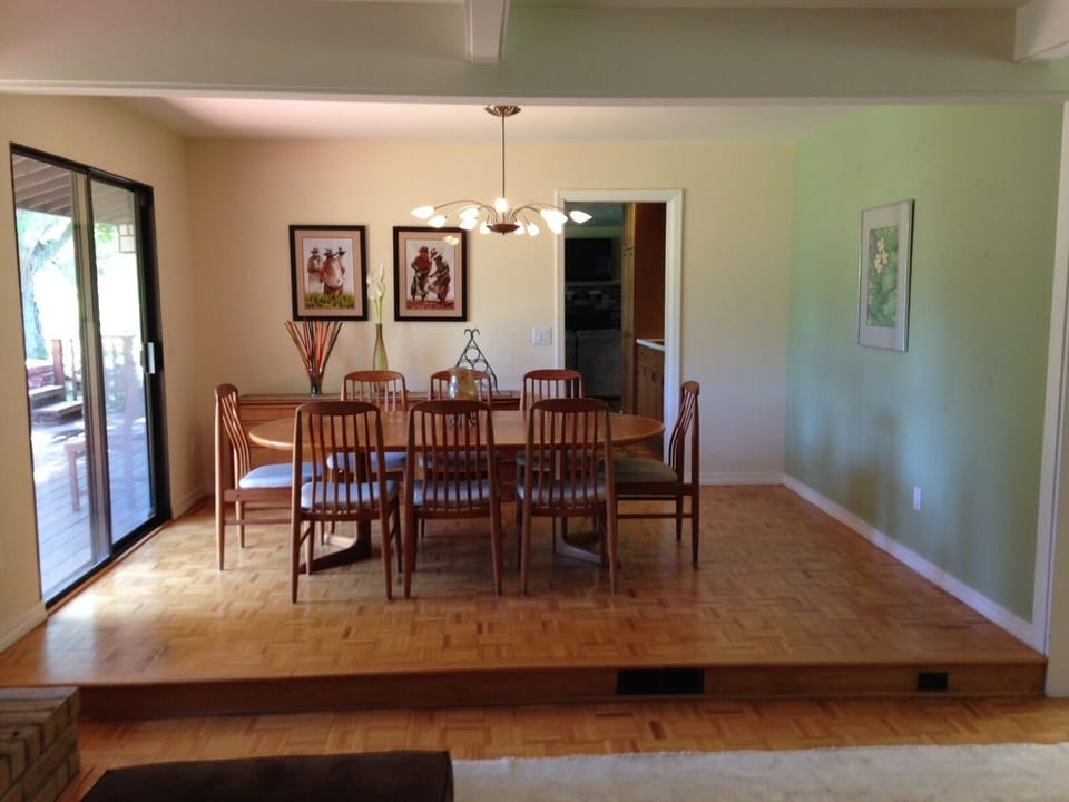 Dining room with seating for 8 adjacent to the living room