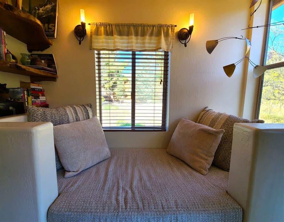 Cozy reading nook with a red rock view