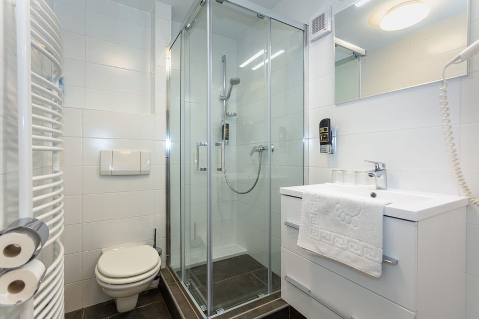 Family Quadruple Room, Non Smoking, Balcony | Bathroom | Shower, hair dryer, towels