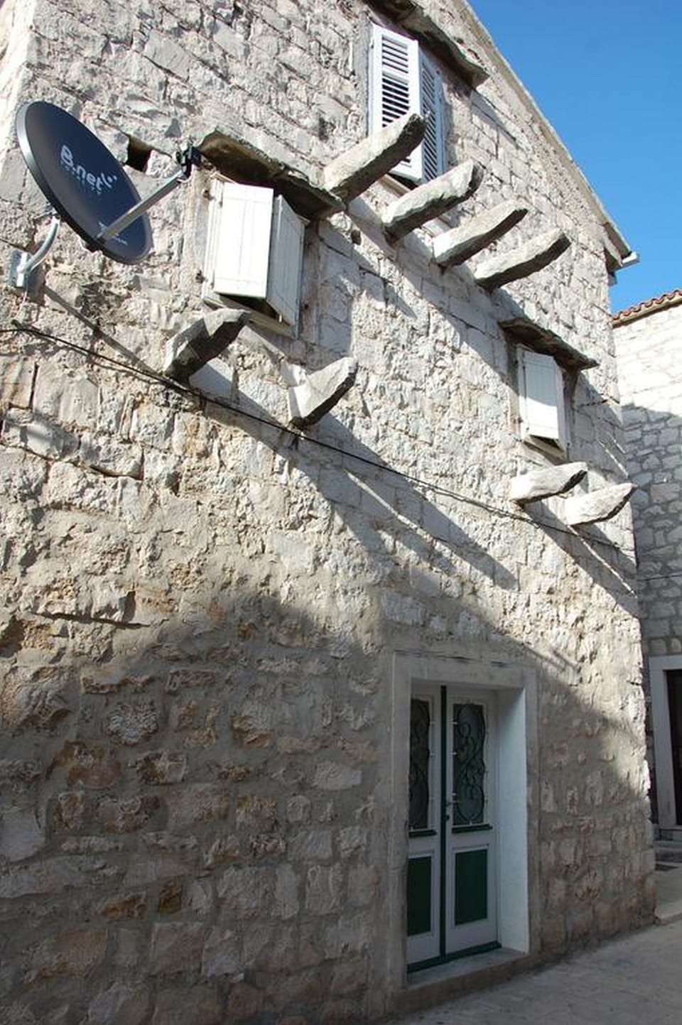 Traditional dalmatian stone house - property building and the entrance. 
