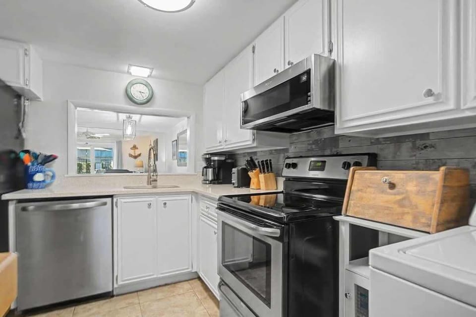 Bright and inviting, this fully equipped kitchen offers everything you need for effortless vacation living - perfect for morning coffee and casual lunches.