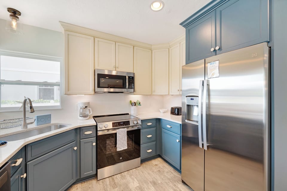 Smooth top range, full size refrigerator and built in microwave