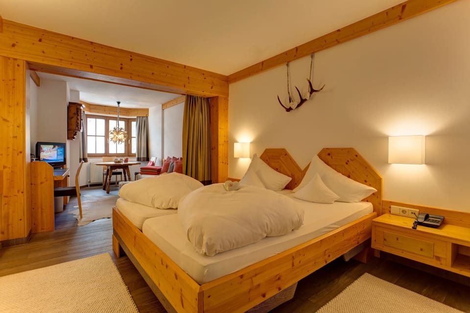 Junior Suite, Mountain View | Minibar, in-room safe, desk, iron/ironing board