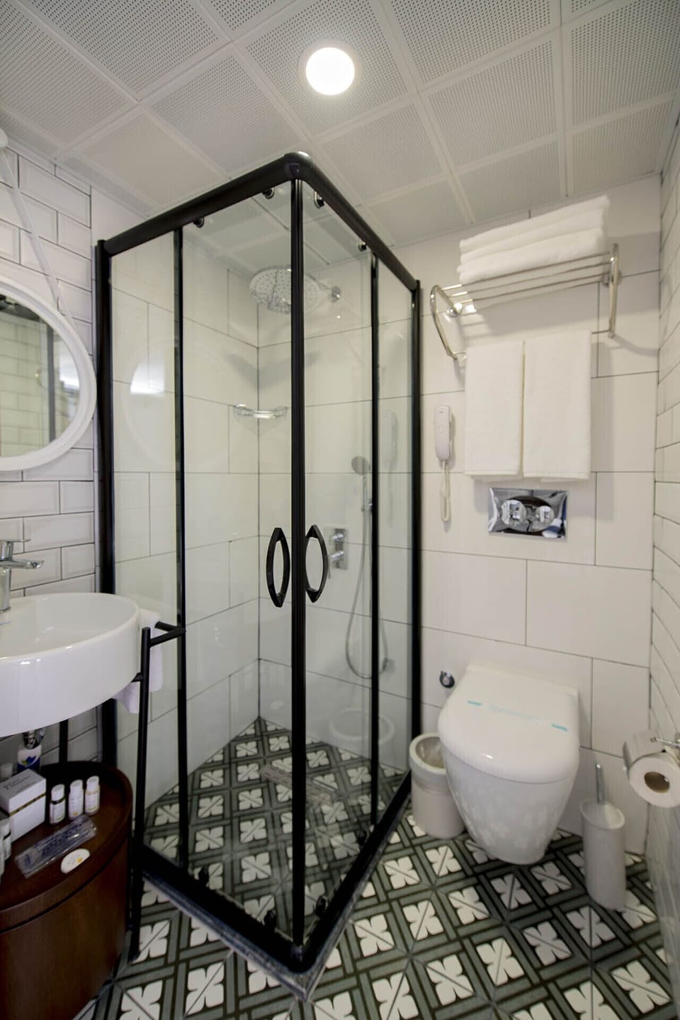 Shower, designer toiletries, hair dryer, slippers
